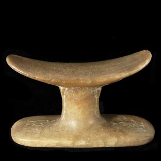 Alabaster Headrest with Reliefs of Bes and Maat