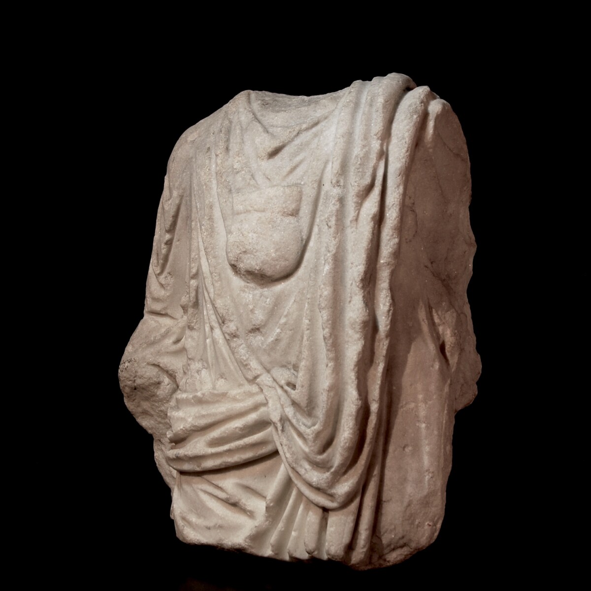 Roman marble togatus with bulla half left