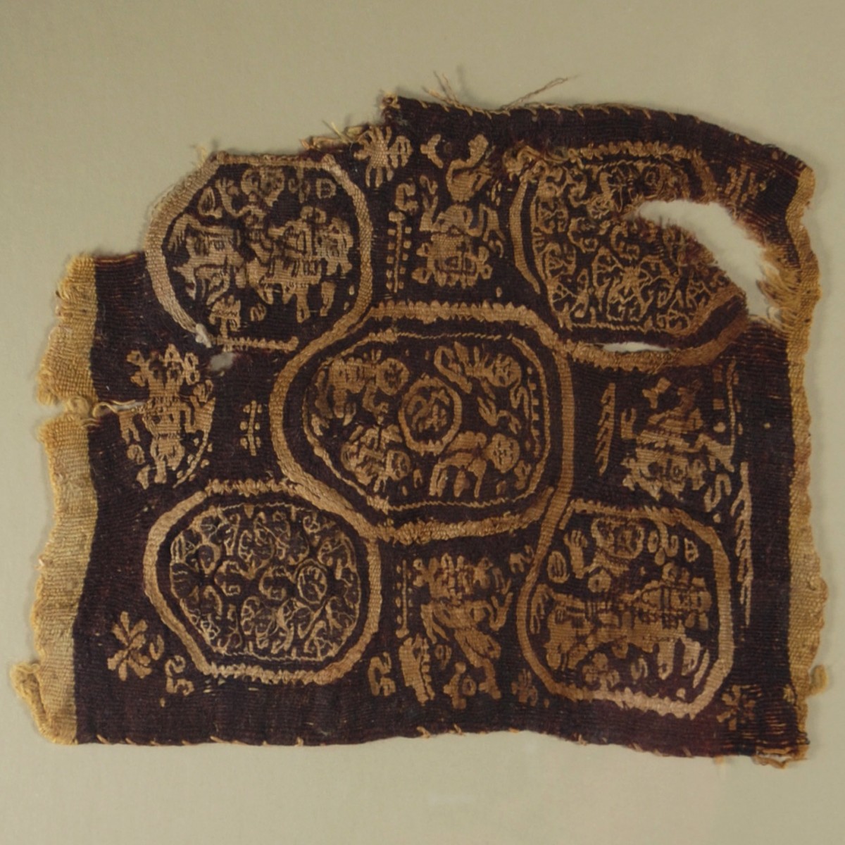 Coptic textile with dancers and riders close