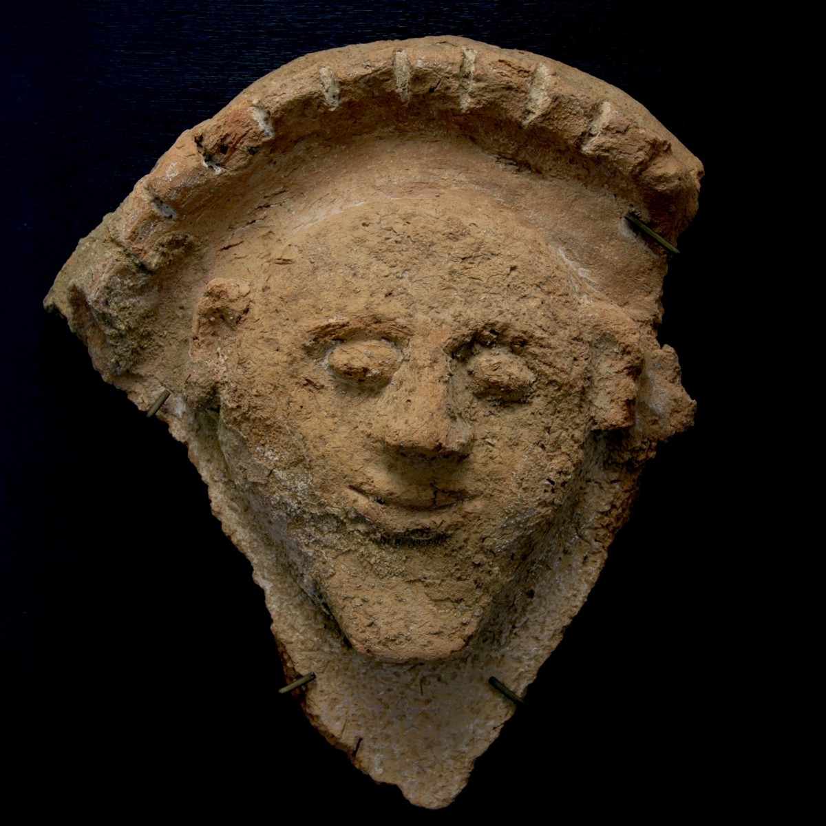 Egyptian terracotta sarcophagus lid fragment