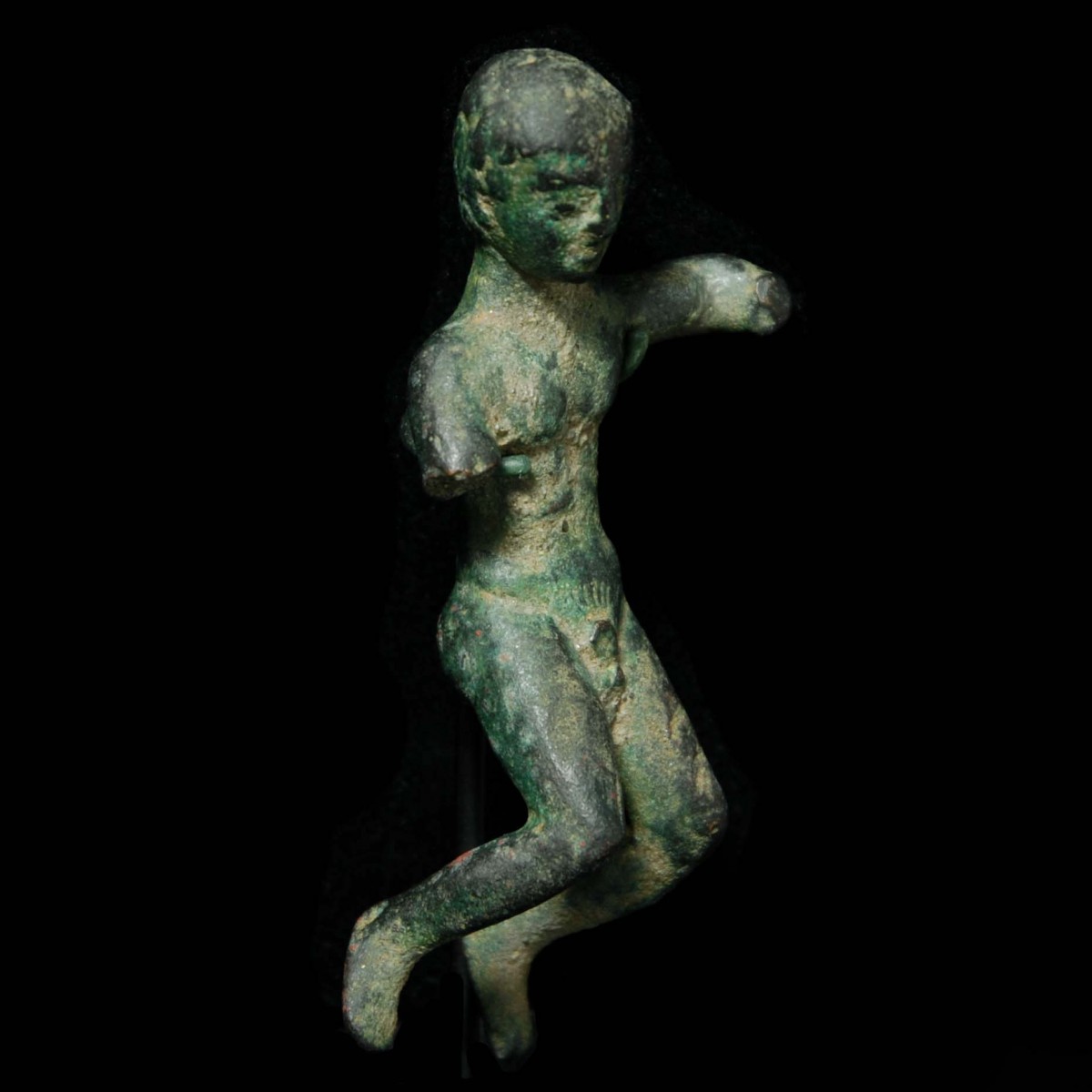 Etruscan votive figure of a youth with inscription right