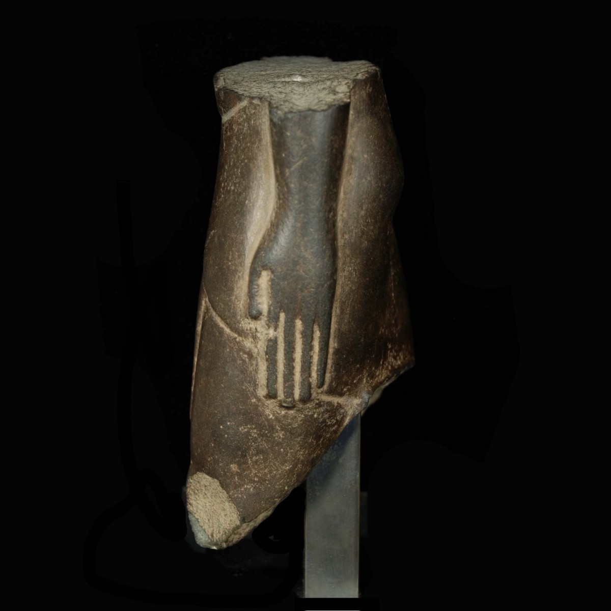 Egyptian basalt torso of a man left