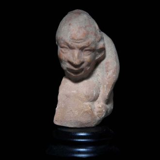 Fragment of a Terracotta Statuette of an Actor with a Wineskin