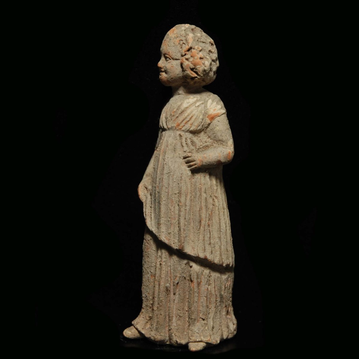 Tanagra statuette of a young girl left