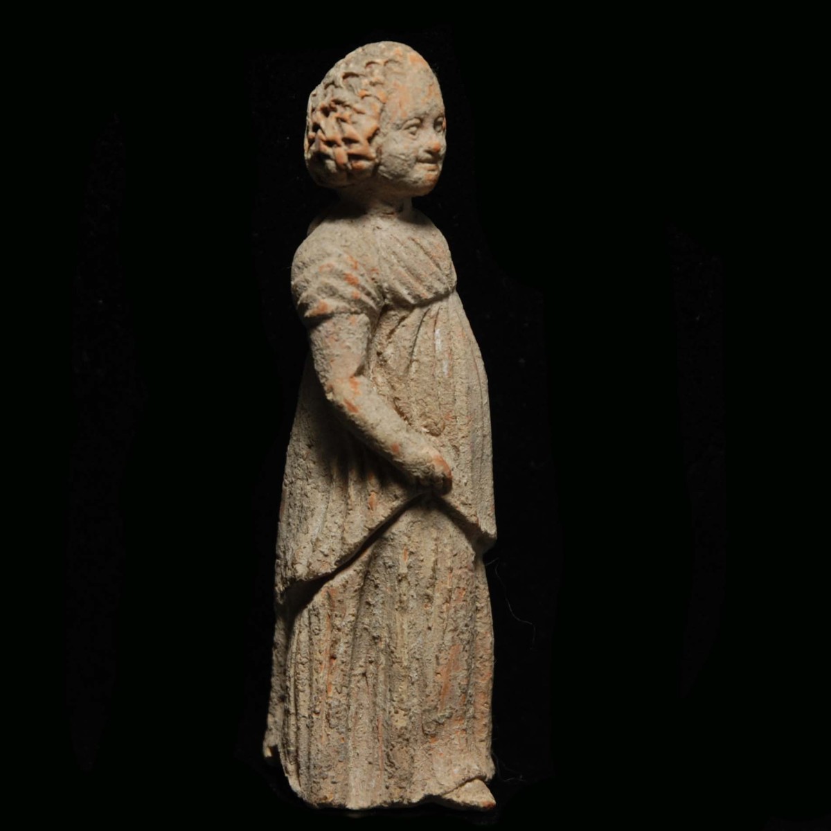 Tanagra statuette of a young girl right