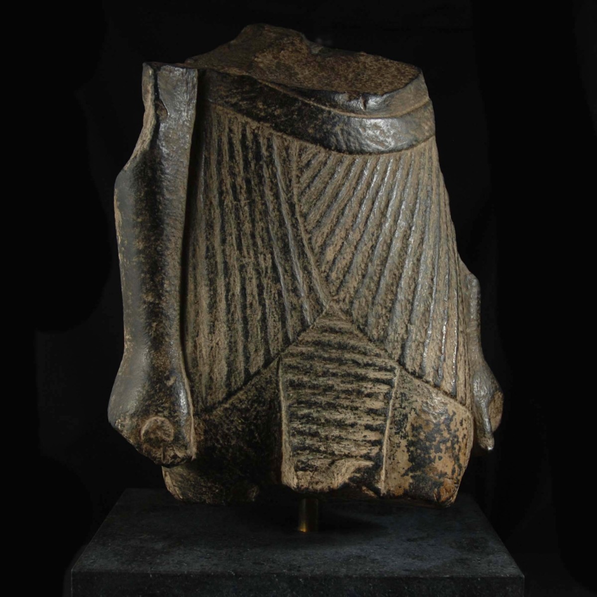 Egyptian Basalt torso of a striding man top