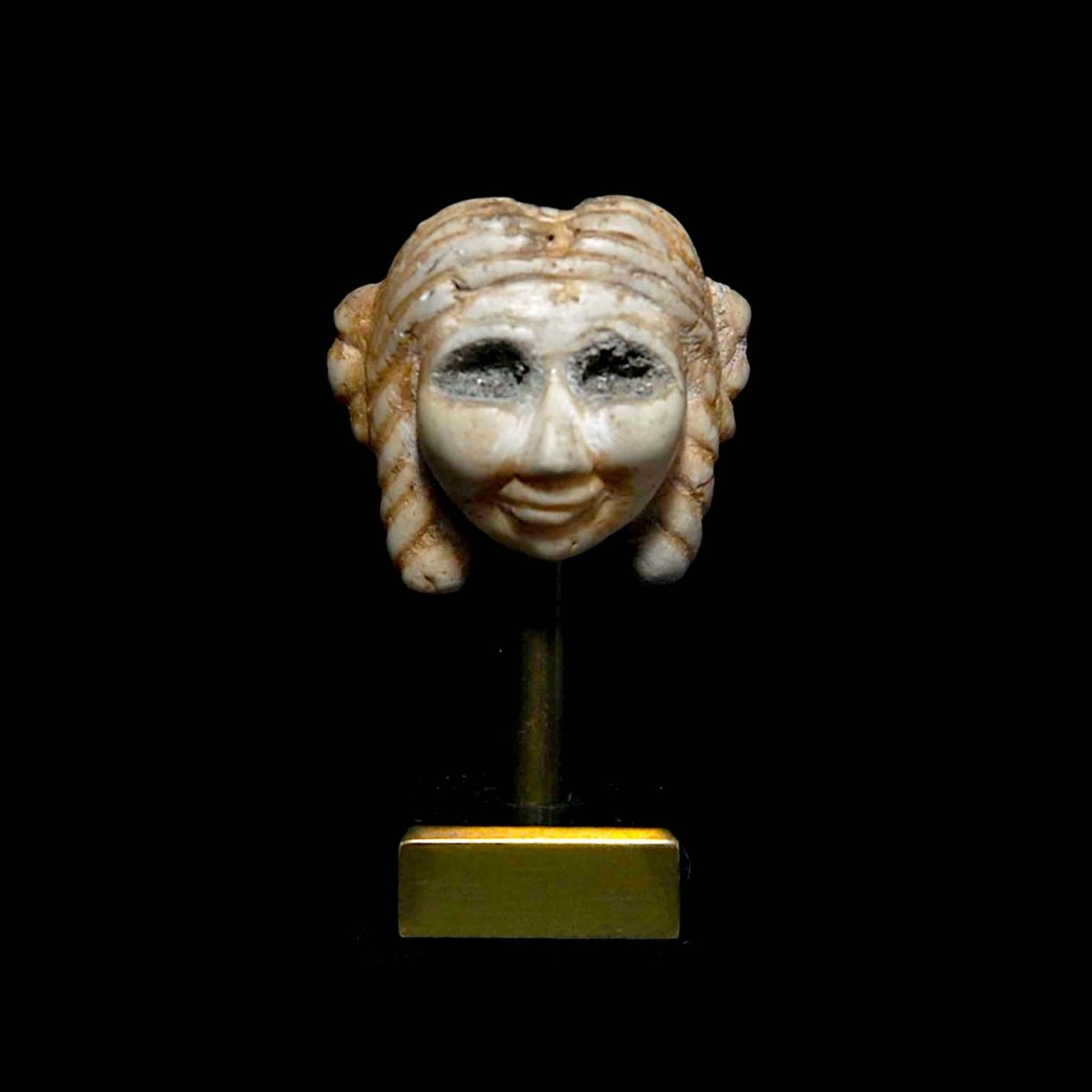 Sumerian head amulet of a woman