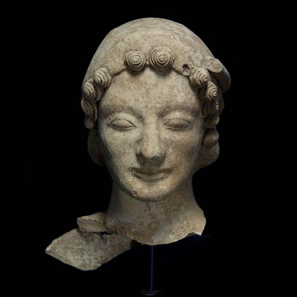 Greek archaic terracotta head of a goddess