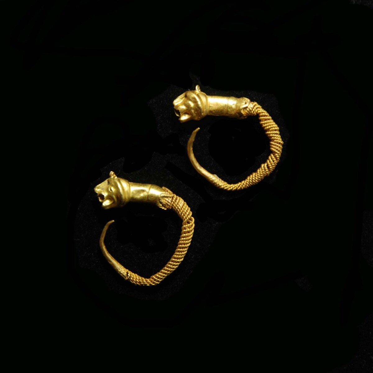 Greek hellenistic gold earrings with lion heads