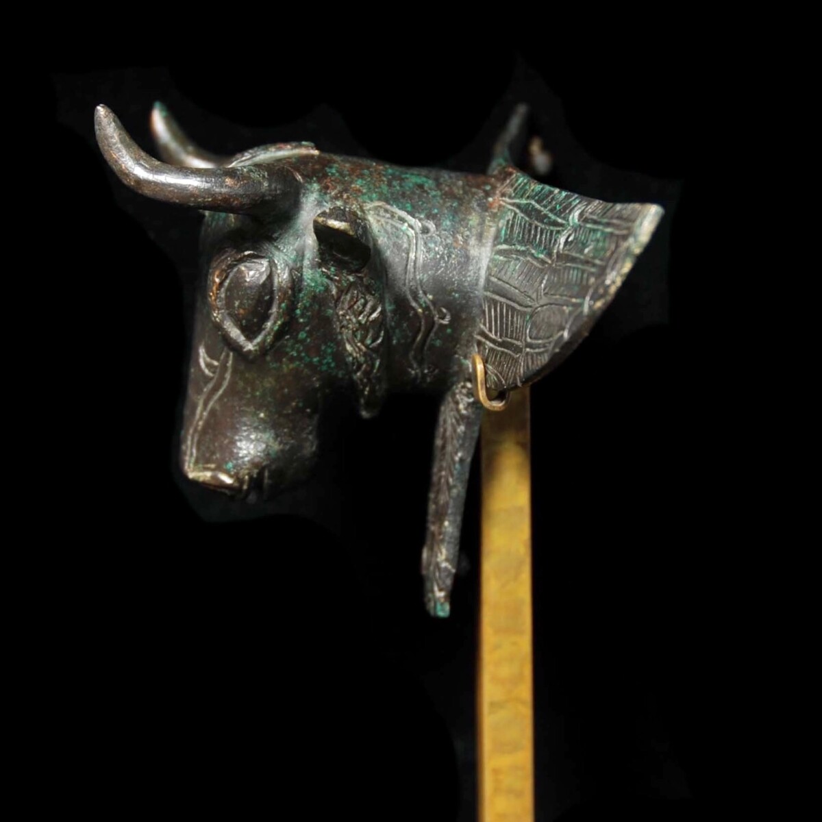 Urartian bronze applique of a bull left