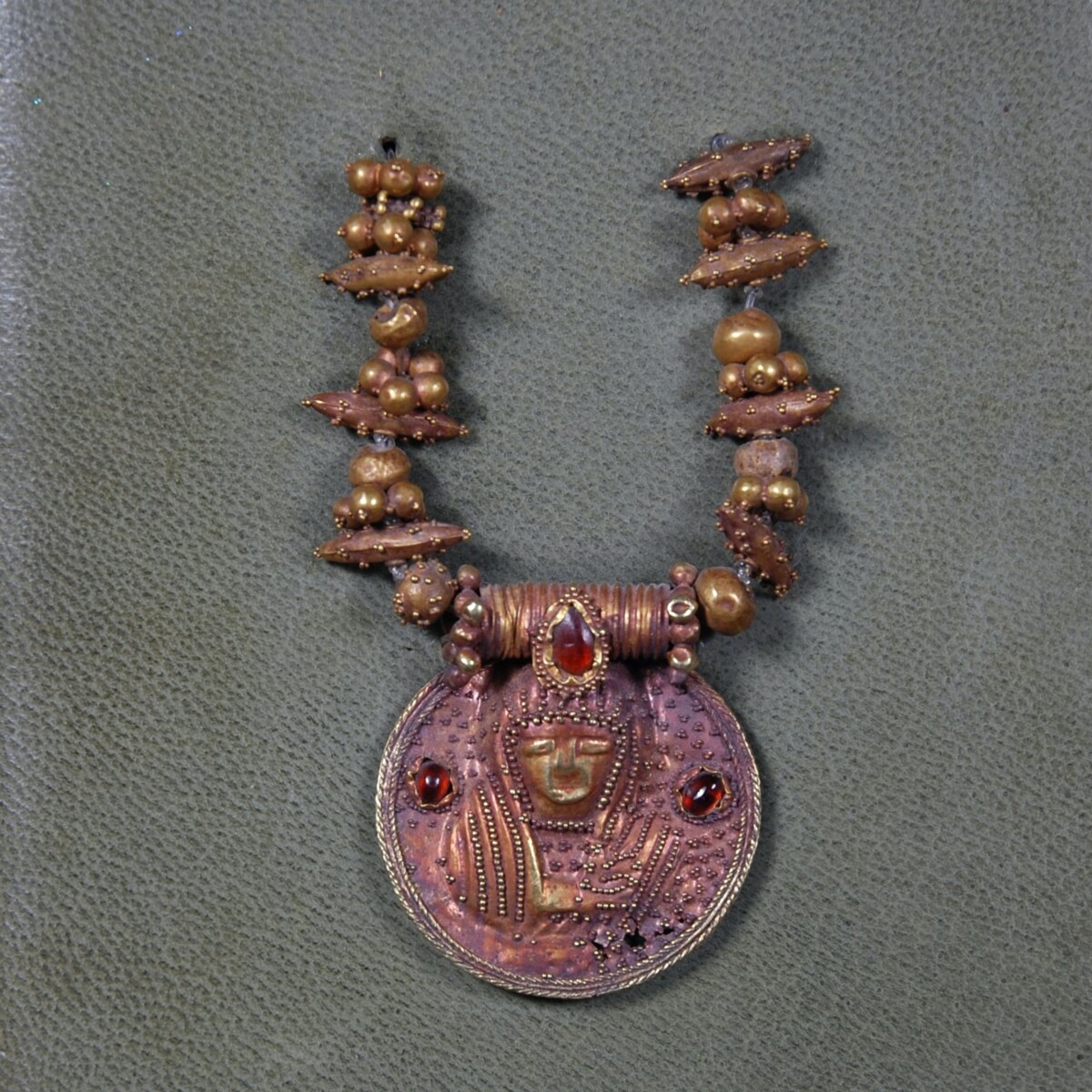 Byzantine gold medaillon with saint and garnet