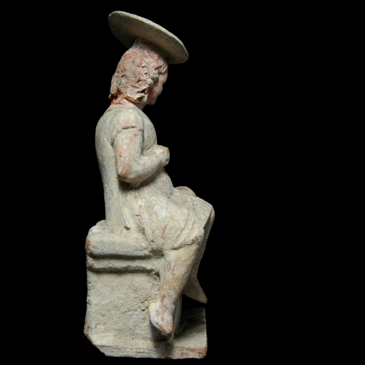 Hellenistic Tanagra statuette of a girl with sun hat and ball right