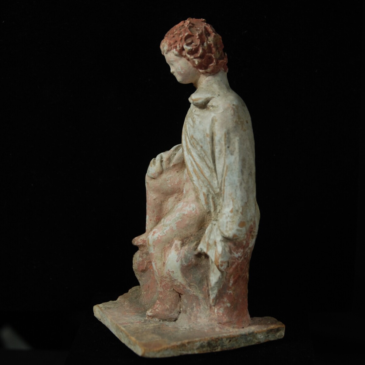 2 Tanagra terracotta statuette of a boy left