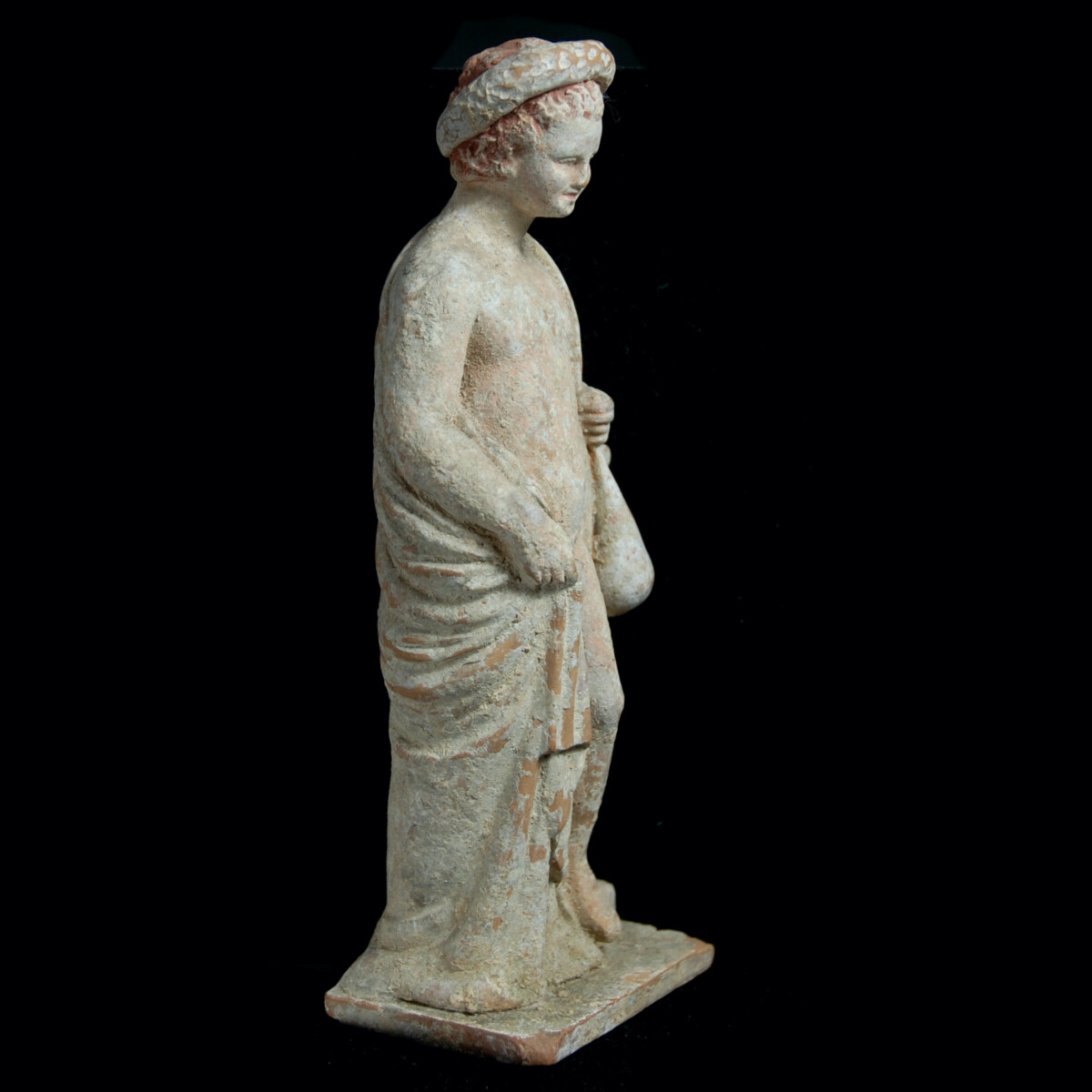 3 Tanagra terracotta boy with money bag right
