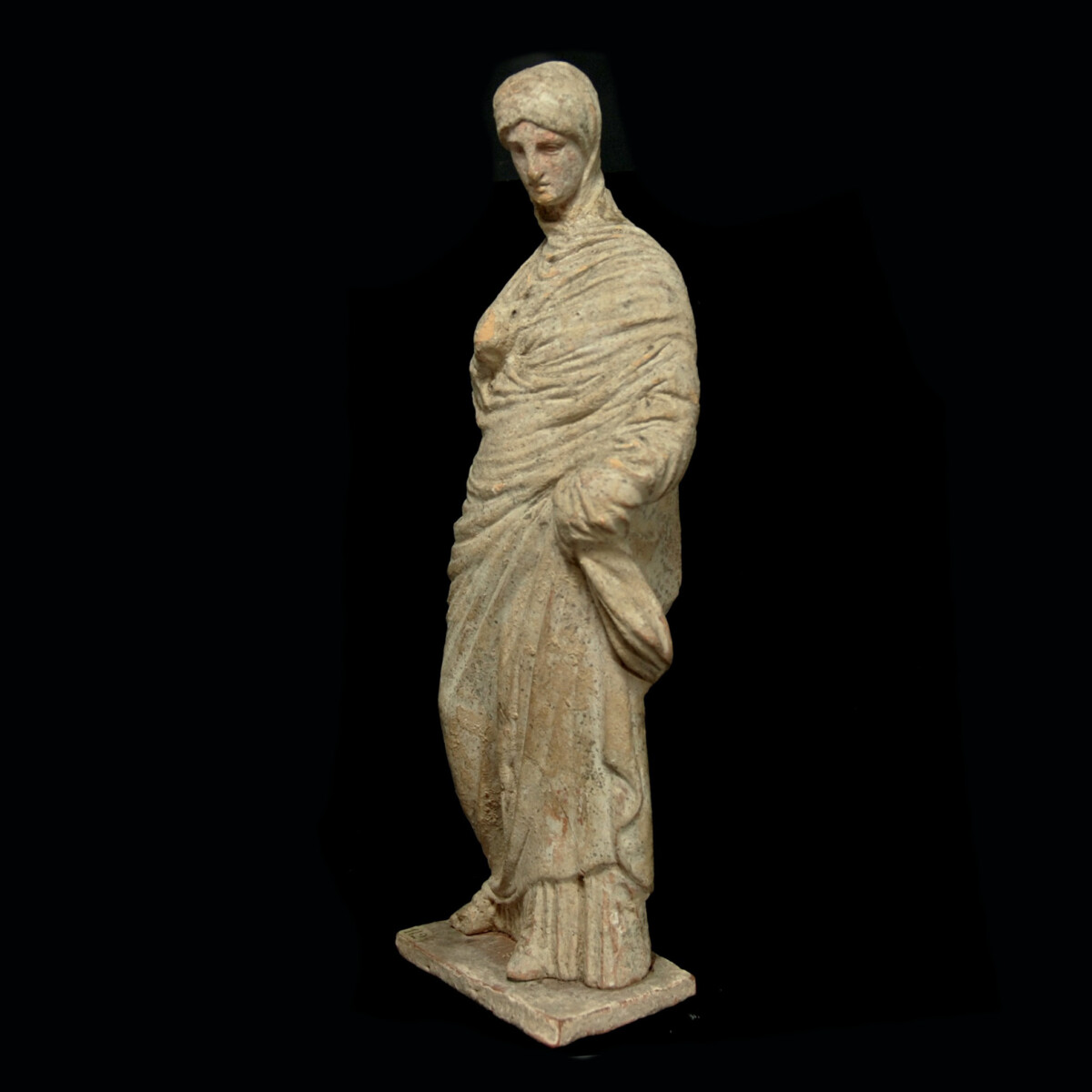 8 Tanagra statuette of a veiled woman left