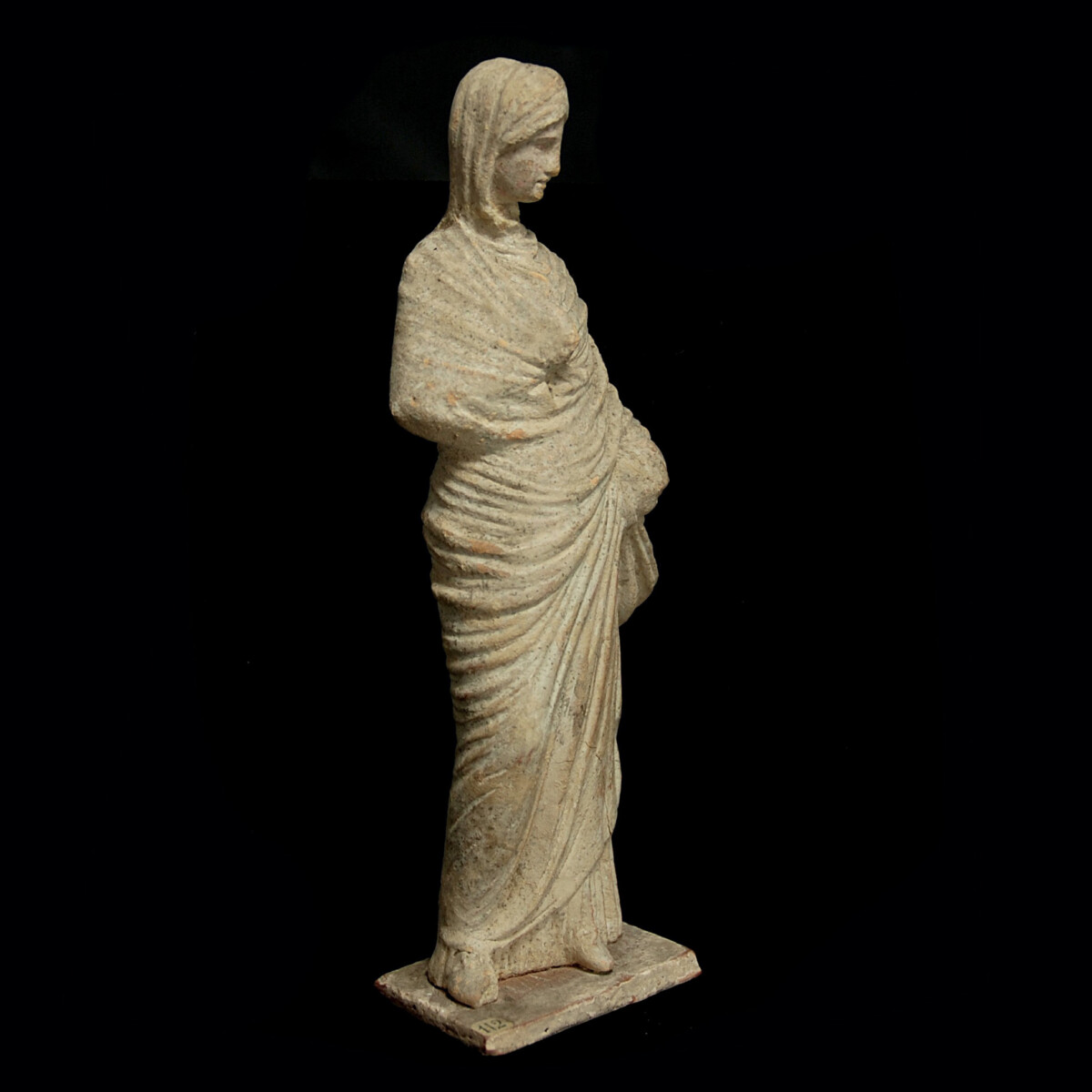 8 Tanagra statuette of a veiled woman right