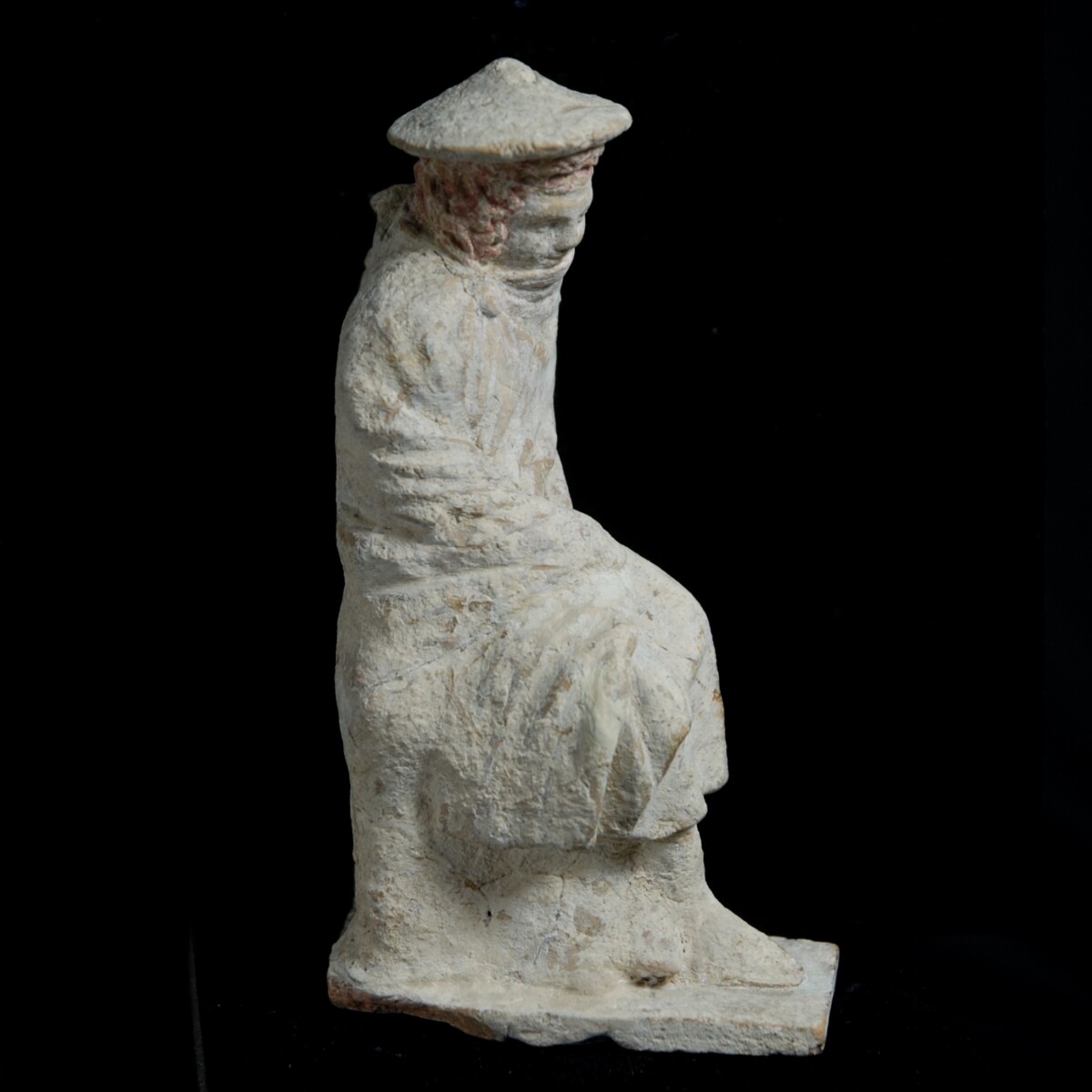 9 Tanagra statuette of a boy leaning on a stele right