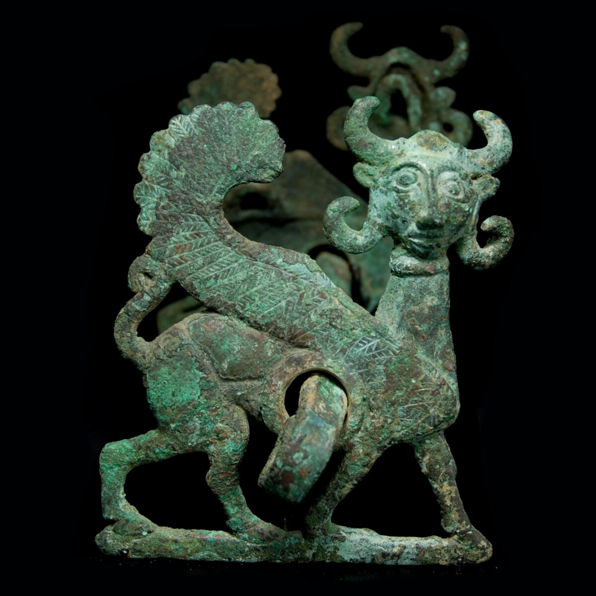 Luristan Bronze cheek pieces with winged sphinx right