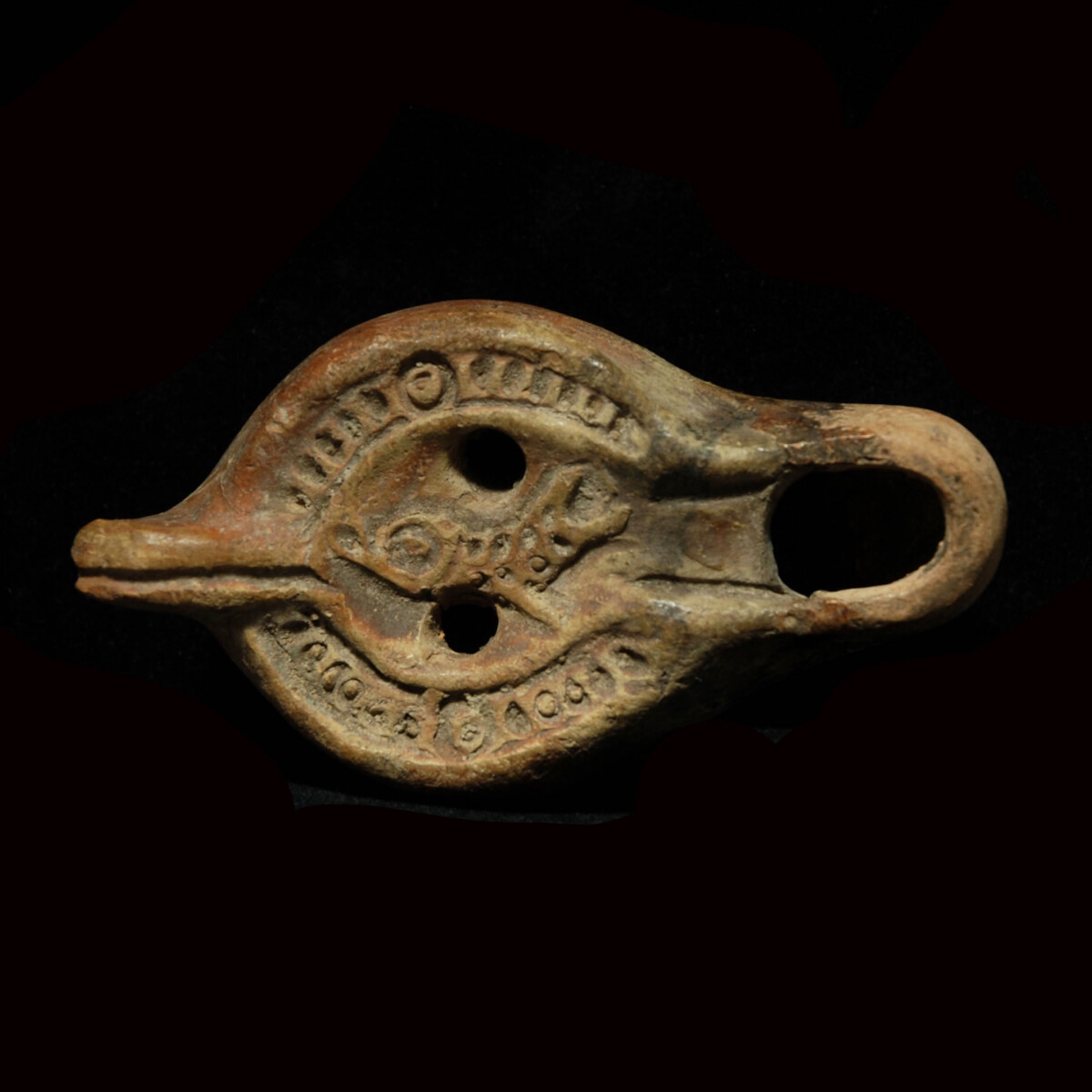Early Christian oil lamp with fish