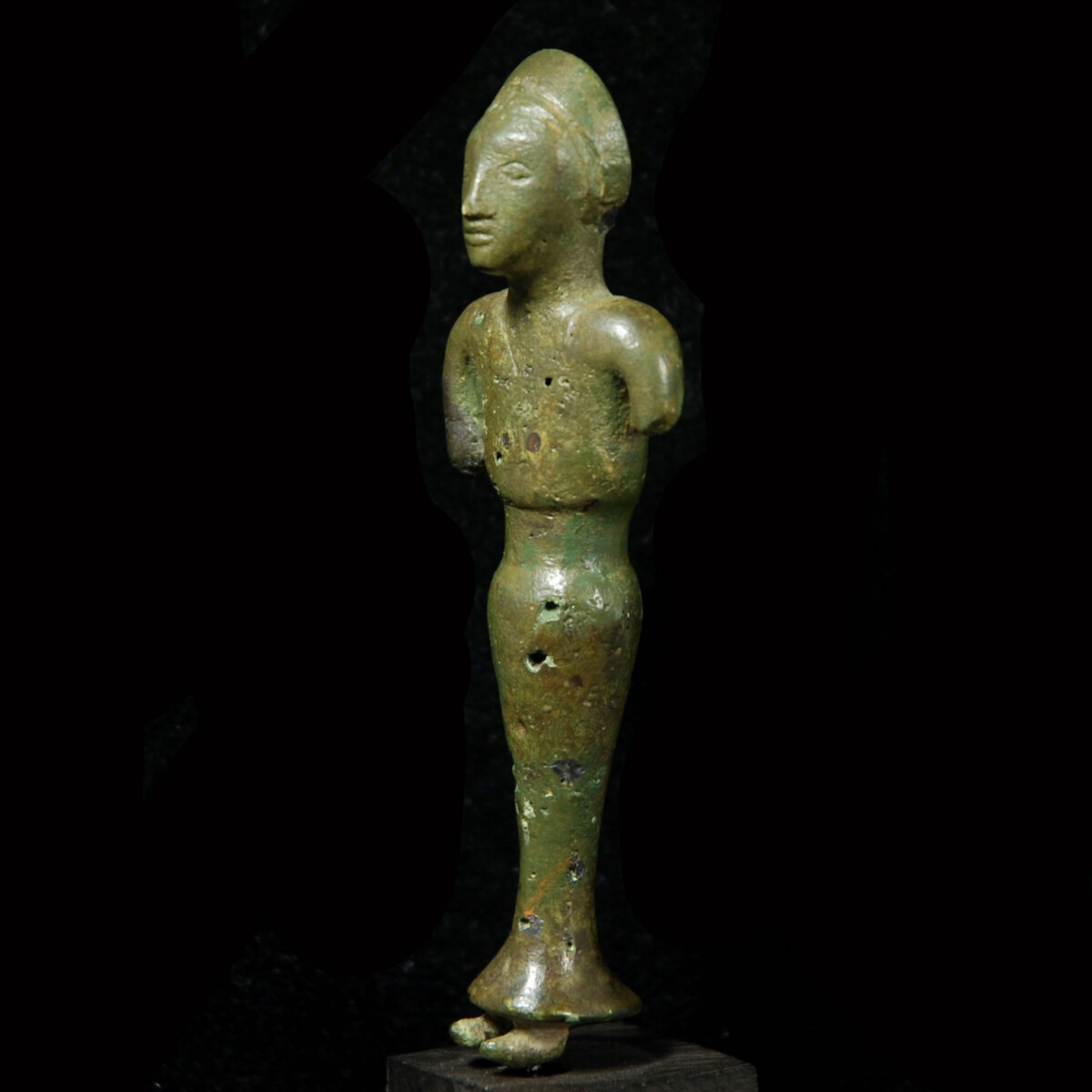 Iberian bronze statuette of female worshipper half left