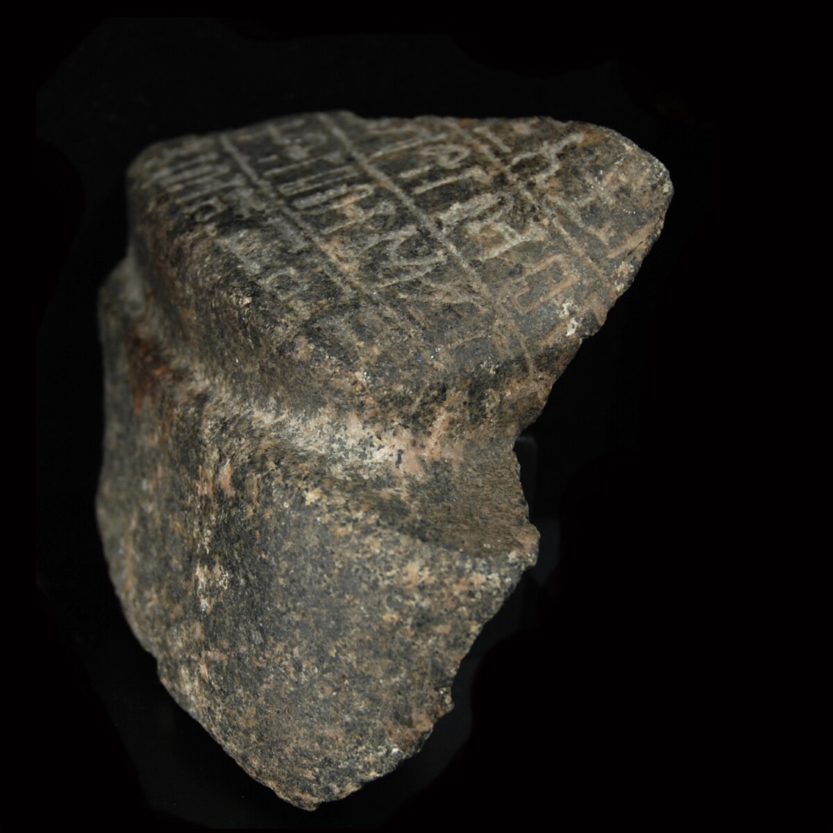 Egyptian granodiorite fragment of a statue side