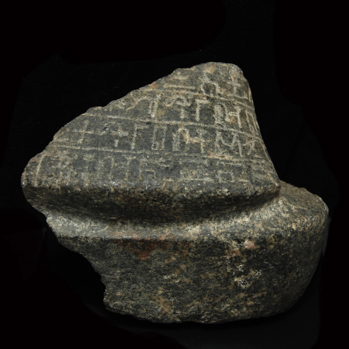 Egyptian granodiorite fragment of a statue up