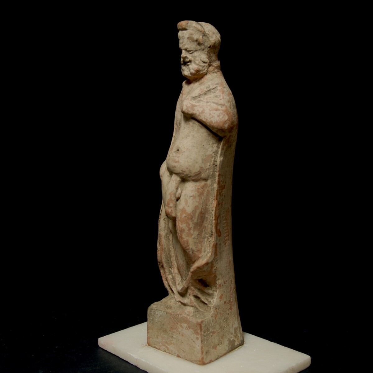 Hellenistic terracotta statuette of an ityphallic silen left