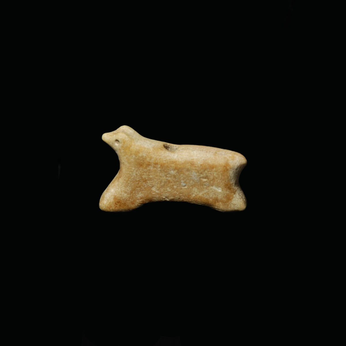 Jemdet Nasr marble amulet of a running animal left