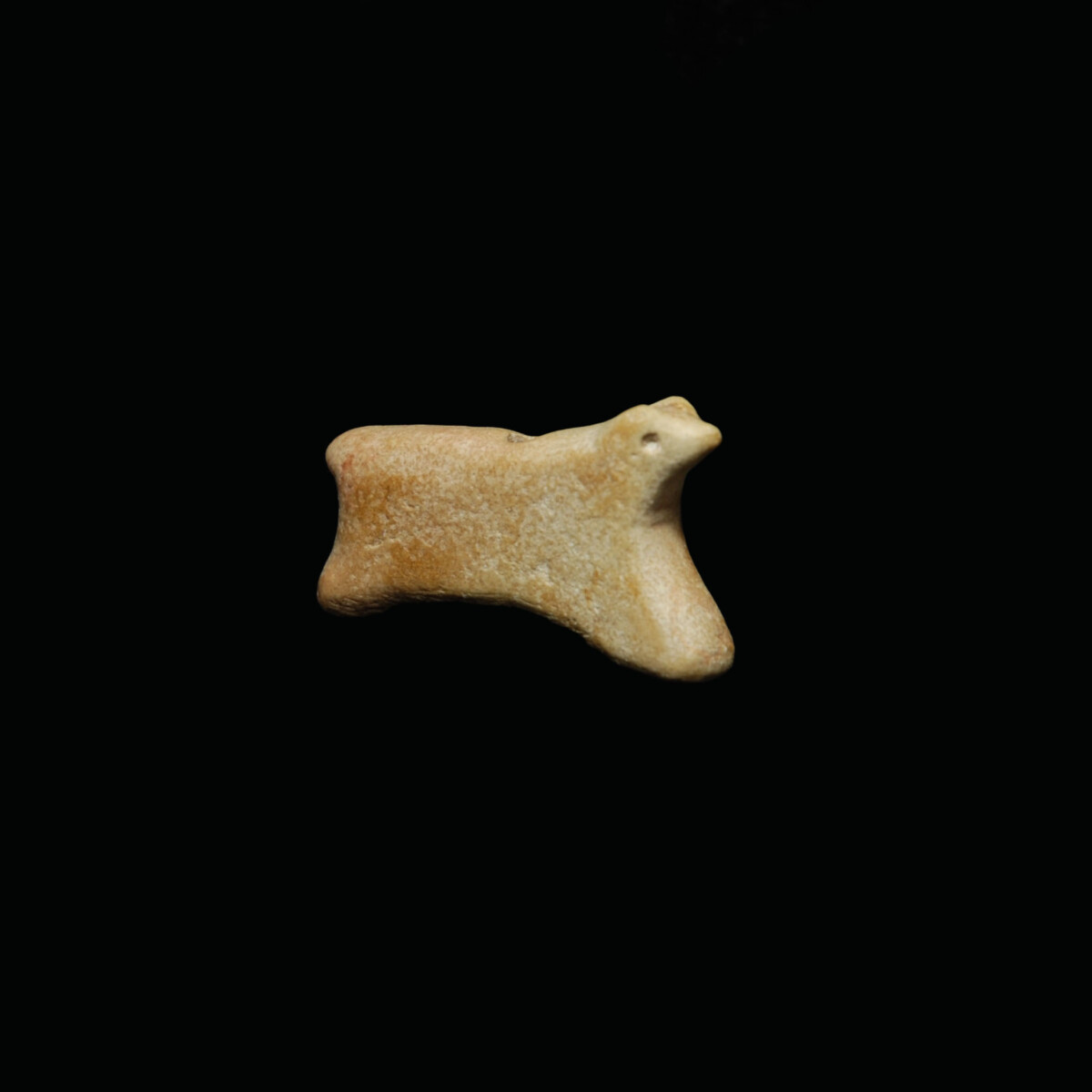 Jemdet nasr marble amulet of a running animal