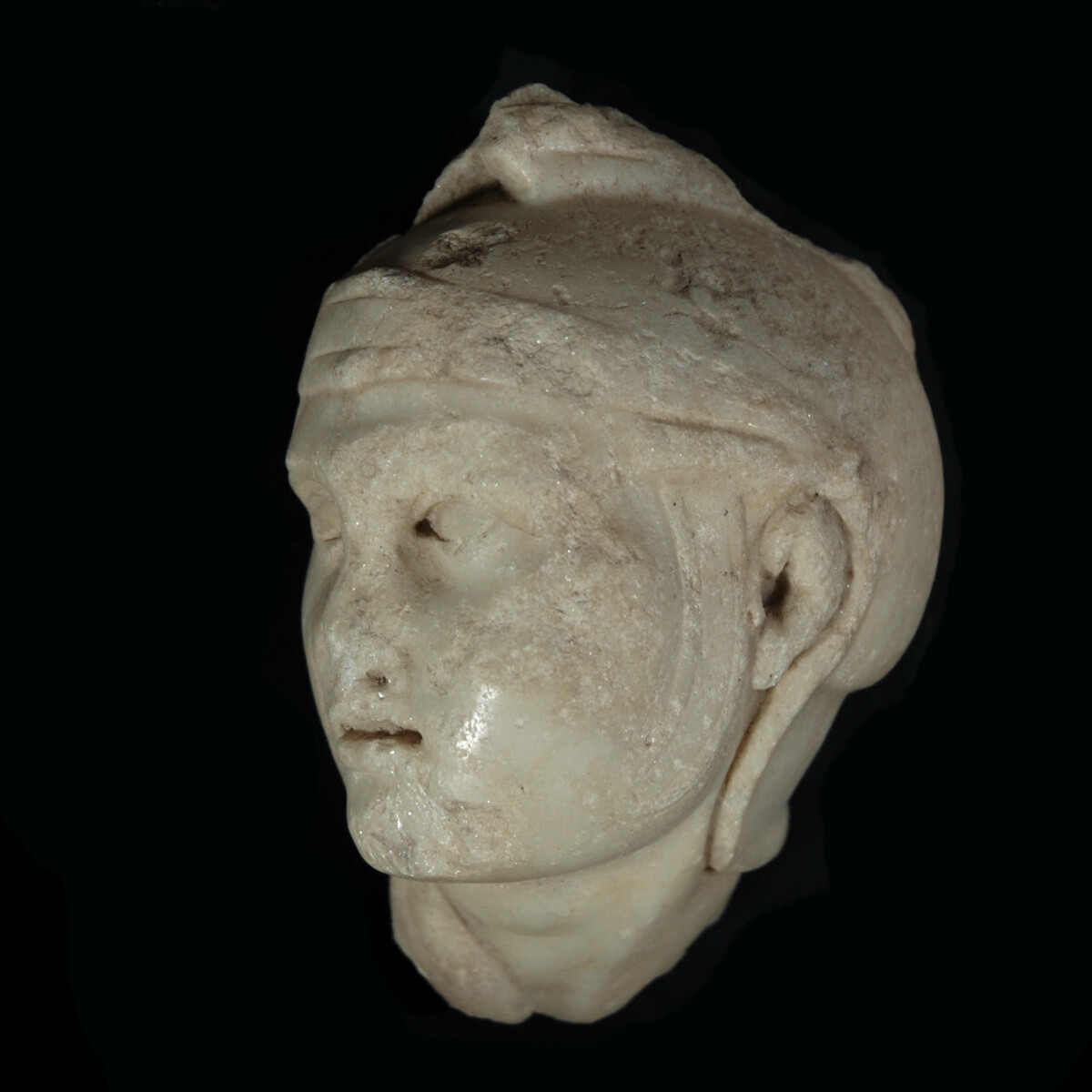 Marble relief head of a soldier from an attic sarcophagus