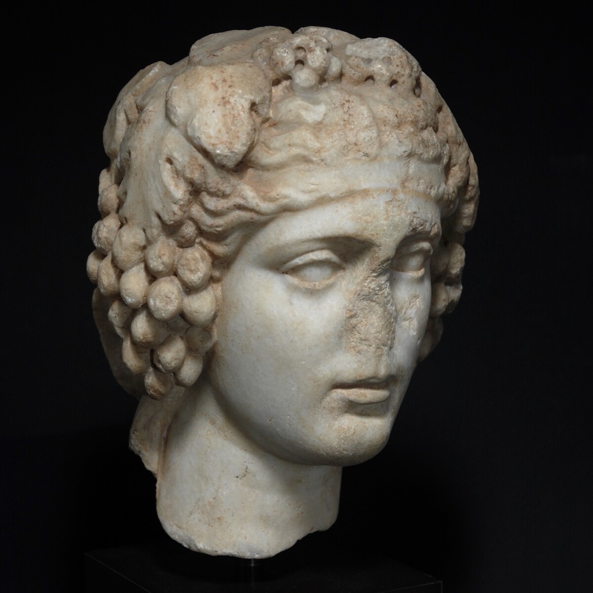 Marble head of Dionysus of the type Horti Lamiani front right