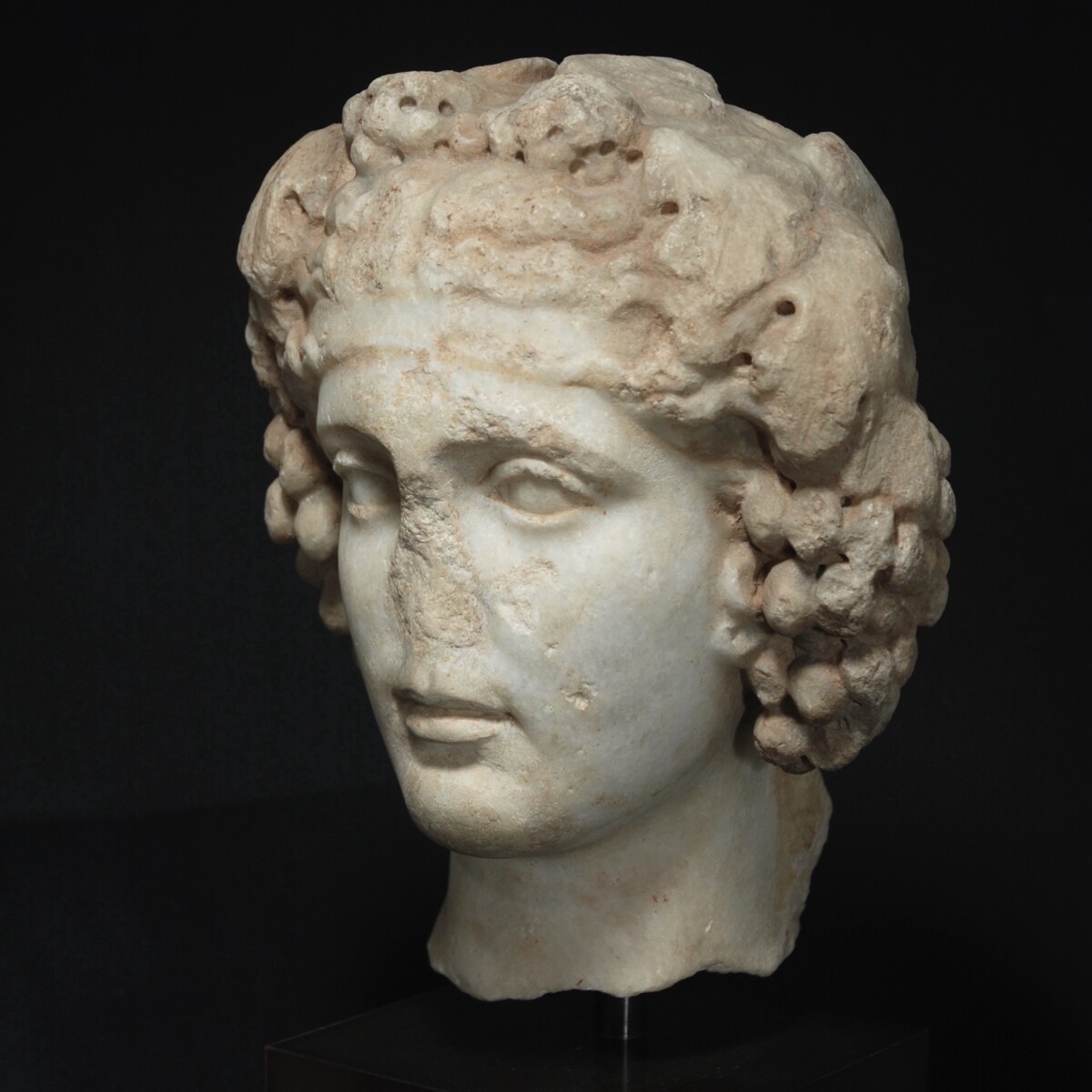 Marble head of Dionysus of the type Horti Lamiani half left