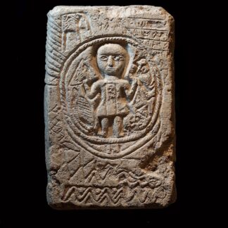 Coptic Limestone Funerary Stele Depicting a Boy in an Ouroboros